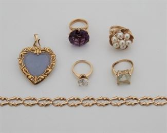 2129
Group Of Gold Jewelry
14k yellow gold
Comprising four rings set with various stones comprising topaz, amethyst, simulated diamond, and cultured pearls; a heart pendant set with lavender jade; and a link bracelet
Heart pendant: 2" H x 1.2" W
48.5 grams gross
3 pieces
Estimate: $900 - $1,200