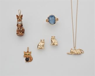 2134
A Group Of Cat Jewelry
14k yellow gold and sterling silver
Comprising a cat pendant with attached chain, an enamel cat pendant, a silver enamel pendant with diamond set collar, a cat cameo hardstone ring (6.75), and a pair of cat earrings
Largest pendant: .5" W x 1.25" H
14k gold: 21.5 grams; Silver: 20 grams
6 pieces
Estimate: $600 - $800