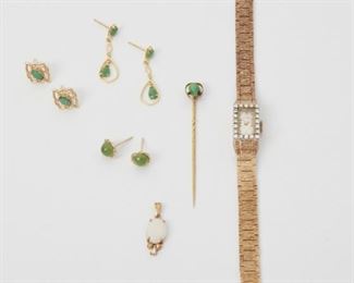 2137
A Group Of Gem-Set Jewelry
14k yellow gold
Comprising a Navarre watch set with twenty single-cut round diamonds totaling approximately 0.30ct and graded H-I color, SI clarity (6.75" L x .375" W), a white opal and diamond pendant (.25" W x .875" H) suspended on a detachable neck chain, a pair of jadeite-set drop earrings (1" H), a jadeite stick pin (.25" W x .375" H), a pair of emerald-set earrings (.375" W x .5" H), and a pair of round green agate-set earrings (.25" W)
28.5 grams
8 pieces
Estimate: $400 - $600
