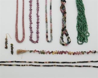 2166
A Group Of Bead Jewelry And Hanks
Comprising a hank of multi-colored tourmaline briolette beads (6mm W x 8mm H), a hank of graduated ruby beads (4.5mm -9.4mm), a faceted hank of ruby beads of various shapes (19" L) , a six-strand tumbled emerald bead necklace with gold-plated clasp (31" L), a hank of faceted sapphire, colored sapphire, and ruby beads (6.5mm W x 4mm H), two strands of multi-colored tourmaline bead necklaces with metal clasps (58" L & 32" L), a pair of multi-colored tourmaline drop earrings (1.375" H) on base metal wire hooks
9 pieces
Estimate: $400 - $600