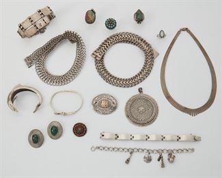 2178
A Group Of Sterling Silver Jewelry, Including Hector Aguilar
Comprising a Hector Aguilar sterling curved and spherical link bracelet; four additional bracelets; three link necklaces; four rings; two brooches; one pair of malachite earrings and an Aztec calendar pendant
572.9 grams gross
17 pieces
Estimate: $300 - $500