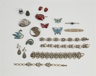2190
A Group Of Silver Jewelry, Including Danish Silver
Comprising five bracelets; three butterfly brooches; five various brooches; two pairs of earrings (back missing from one); two thimbles; and a group of miscellaneous costume jewelry
249 grams gross (not including costume jewelry)
20 pieces
Estimate: $300 - $500