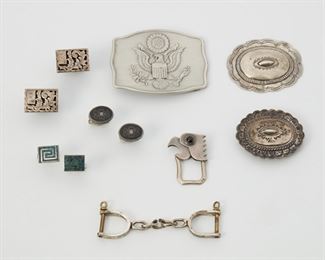 2192
A Group Of Gentleman's Accessories
Comprising three pairs of cufflinks; two belt buckles; a concho and two key chains; and a metal "American Eagle Seal of US belt buckle"
145 grams gross (not including metal seal belt buckle)
11 pieces
Estimate: $300 - $500