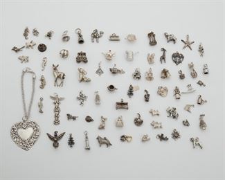 2194
Group Of Silver Charms And Jewelry
Comprising a bracelet, a giraffe brooch, and multiple various whimsical charms
235 grams gross
68 pieces
Estimate: $400 - $600