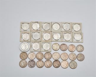 2215
Thirty-Four U.S. Silver Dollars
Morgan and peace dollar coins in various years including: 1879 x 2, 1881 x 3, 1881 x 6, 1882 x 2, 1890 x 2, 1896, 1897, 1900, 1921 x 3, 1922 x 10, 1923 x 2, 1934.
943 grams gross, including sleeves
34 pieces
Estimate: $600 - $800