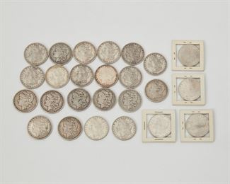 2219
Twenty-Five U.S. Silver Dollars
Morgan silver dollar coins including: 1878, 1880 x 2, 1881 x 7, 1884 x 4, 1885 x 2, 1888, 1889 x 2, 1891, 1892, 1900 x 2, 1901, 1921
660 grams gross
25 pieces
Estimate: $600 - $800
