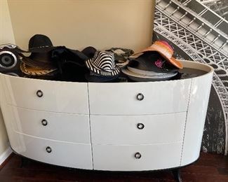 Chic Oval White Dresser with Six Drawers, Variety of Hats