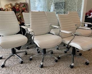 Six White Leather Office Chairs
