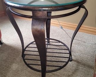 $85.00 each, two available, Cast metal side table 25" tall 21" across