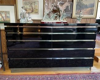 Jean Claude Mahey black lacquer 10-drawer chest of drawers with brass foot plate. Circa 1970s.  Excellent condition. Two available. Each measures 51"W x 18"D x 30"H. Photo 1 of 3