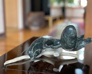 Marble seals mounted on whale bone