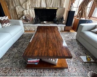 Theodore Alexander cocktail table. Wood veneer with lucite side panels. Measures 60"W x 30"D x 16"H. Photo 1 of 2 