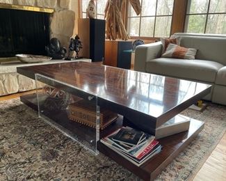 Theodore Alexander cocktail table. Wood veneer with lucite side panels. Measures 60"W x 30"D x 16"H. Photo 2 of 2