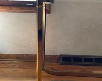 Mid-century brass console with glass top. Measures 27"H x 56"W x 16"D. Photo 2 of 2 