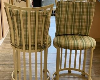 Set of four metal dining chairs.
