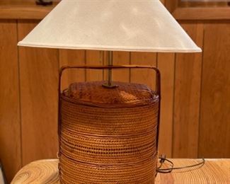 Vintage woven rattan basket table lamp.