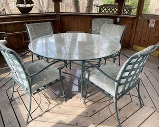 Brown Jordan Florentine outdoor dining collection includes round metal glass-top table. Six arm chairs, one side table and an ottoman. Photo 1 of 5