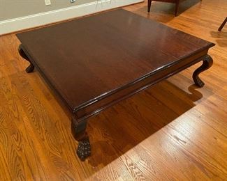 48” square solid mahogany coffee table with claw feet. Sits 16.5” from ground.