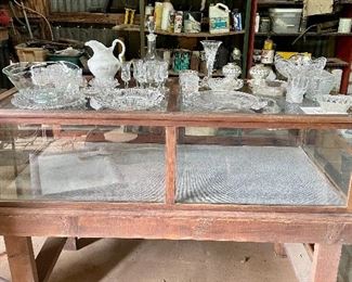 Old display cabinet with pressed and cut glass items