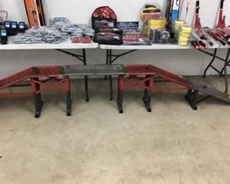 A pair of customized raised metal car ramps.