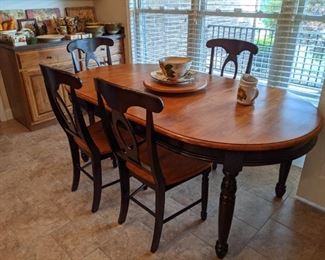 Another black/cherry dining table with 4 chairs