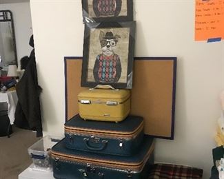 Vintage suitcases, white blanket chest, fun artwork
