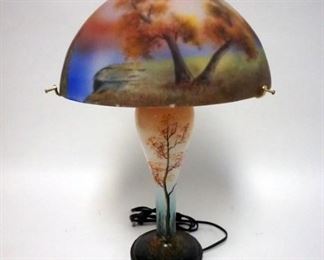 1025	CONTEMPORARY PAINTED GLASS LAMP, HAS SOME MINOR PAINT LOSS ALONG THE SHADE RIM
