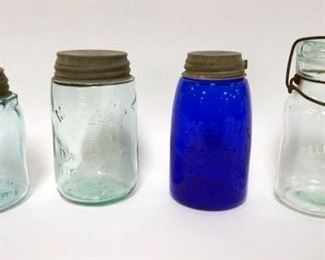 1030	4 CANNING JARS INCLUDING COBALT BLUE MASON, 3 W/ ZINC LIDS ONE W/ GLASS LID TALLEST IS 6 1/2 IN H. LOT ALSO INCLUDES A TELEPHONE JAR, J & B ETC. 
