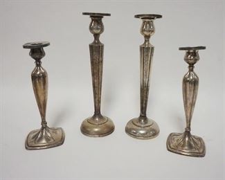 1032	2 PAIRS OF WEIGHTED STERLING SILVER CANDLESTICKS. TALLEST IS 10 IN 
