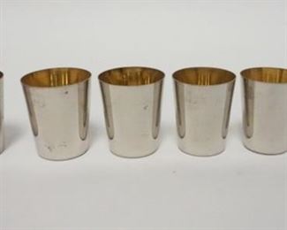 1064	NEST OF 6 SILVER PLATE GOLDWASH  SHOT GLASSES, GRADUATED, MADE IN GERMANY, 1 3/4 IN HIGH
