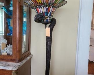 17.) Bronze Floor Lamp with cobra form supporting a multi stained glass shade. 7'h.