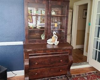 16.) American Empire Period secretary book case, with fold out slant righting surface and a pair of wide drawers below.  Flame mahogany and ash secondary wood. 