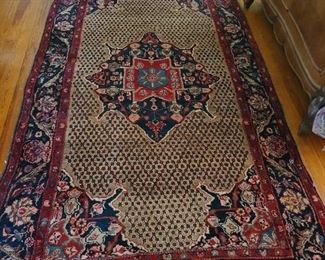 28.) Persian wool carpet 9'9" x 5' semi antique.