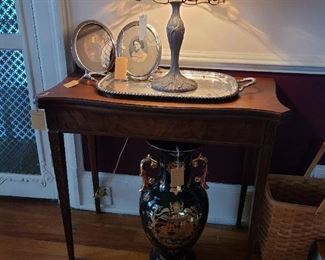 53.) Mahogany fold-over game table circa 1950, Tiffany Style lamp. Cobalt Palace Vase, Silver plate tea tray. and a pair of vintage pictures.