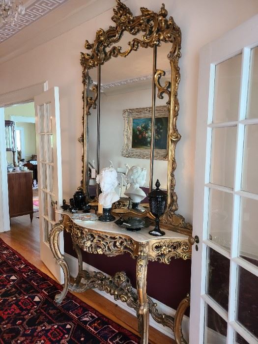 1.) Grand Scale Over Mirror and console table in the Rococo Style. Mirror: 71"h. x 61"w. Table: 71"w x 18"d x 35" h. circa 1900.