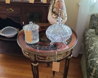 69.) Bouillotte Table with Dutch Marquetry a brass gallery and applied ormolu. 28"d. x 31"h. circa 1950s. 