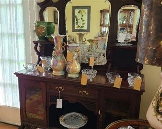 73.) American Belle Époque style server with beveled back mirrors and lower vitrines and low stretcher.    