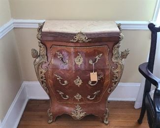 5.) Bombe chest of drawers with inset marble top with a heavy use of ormolu mounts. 28"w x 17"d x 31" h. 