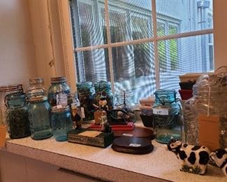 95.) Antique canning jars filled with marbles.