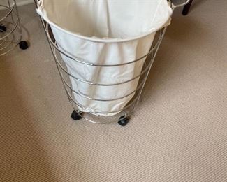 One of two chrome laundry baskets for sale each is 18 “ In diameter and 24 inches high. for sale in person Friday and Saturday
