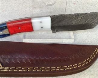 Mfg - Custom Hand Made
Model - Damascus Steel Knife
Caliber - 4" Blade
Located in Chattanooga, TN
This lot contains a Custom hand made Damascus steel fixed blade full tang knife. This knife has a 4" Tanto style blade with an overall length of 8". Comes with a custom embossed leather sheath.