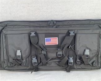 Mfg - Tactical Padded Double
Model - Rifle Case in Grey
Located in Chattanooga, TN
Condition - 1 - New
This lot contains a new in bag padded Tactical double rifle case in urban grey. measures:
3"Dx14"Hx38"W. Padded backpack style carrying straps and hook and loop American flag on the front panel. Has 3 front flap pockets for mags and accessories and one larger zip pocket to hold 2 pistols and magazines.