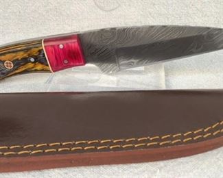 Mfg - Custom Hand Made
Model - Damascus Steel Knife
Caliber - 5.25" Blade
Located in Chattanooga, TN
This lot contains a Custom Hand Made Damascus steel fixed blade full tang knife. 5.25" Blade, overall length 8.75". Comes with a custom leather sheath.