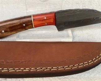 Mfg - Custom Hand Made
Model - Damascus Steel Knife
Caliber - 3.75" Blade
Located in Chattanooga, TN
This lot contains a Custom hand made Damascus steel fixed blade full tang knife. 3.75" Blade, overall length 8". Comes with a custom embossed leather sheath.