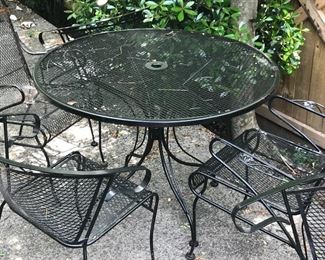 Outdoor patio set
Table with four chairs
Two rocker chairs