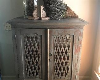 Distressed finish two door cabinet