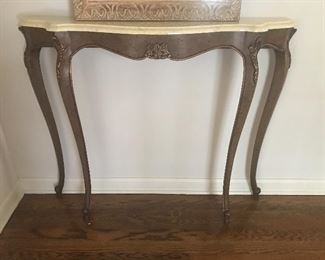 Mid-century petite console with marble top.