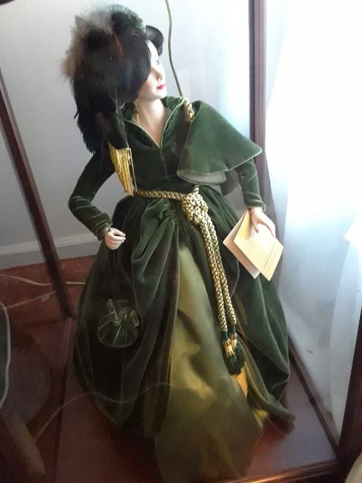 Scarlett O'Hara doll wearing the glorious green dress, standing in case