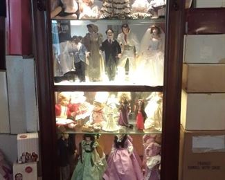 Full length lighted mahogany case with dolls
