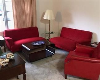 Mid century modern coffee table, nice red couches